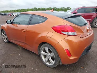 2012 Hyundai Veloster w/Gray Int with VIN KMHTC6AD3CU057620, listed as a IAAI auction lot 42320549 with 113,491 mi miles and . Bid and sale history available at DreamBid. Image 3.
