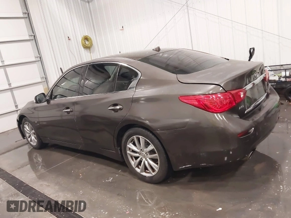2015 Infiniti Q50 Premium z VIN JN1BV7ARXFM418280, wystawiony jako IAAI lot #42080879 z przebiegiem 126 411 mil mil oraz . Historia ofert i sprzedaży dostępna na DreamBid. Obrazek 14.