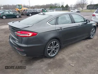 2019 Ford Fusion Titanium with VIN 3FA6P0K9XKR259556, listed as a IAAI auction lot 41823997 with 132,071 mi miles. Bid and sale history available at carsss.com. Image 4.
