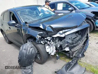 2020 Mazda CX-5 Touring z VIN JM3KFACM6L0804813, wystawiony jako IAAI lot #41797492 z przebiegiem 27 911 mil mil oraz . Historia ofert i sprzedaży dostępna na DreamBid. Obrazek 1.