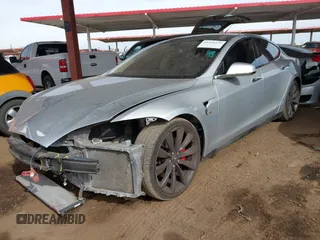 2014 Tesla Model S 60 with VIN 5YJSA1H17EFP35351, listed as a IAAI auction lot 41558434 with 151,002 mi miles and . Bid and sale history available at DreamBid. Image 20.