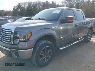 2011 Ford F-150 XLT with VIN 1FTFW1ET7BFC47792, listed as a IAAI auction lot 41765574 with 174,001 mi miles. Bid and sale history available at carsss.com. Image 2.