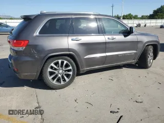 2017 Jeep Grand Cherokee Overland with VIN 1C4RJFCG9HC601806, listed as a Copart auction lot 61786275 with 122,898 mi miles and Salvage title. Bid and sale history available at DreamBid. Image 3.