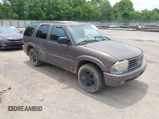 1999 Oldsmobile Bravada z VIN 1GHDT13W3X2710047, wystawiony jako IAAI lot #42481978 z przebiegiem Nie podano mil oraz . Historia ofert i sprzedaży dostępna na DreamBid. Obrazek 1.