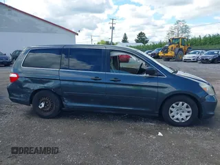 2005 Honda Odyssey LX z VIN 5FNRL38205B128740, wystawiony jako IAAI lot #42209974 z przebiegiem 183 014 mil mil oraz . Historia ofert i sprzedaży dostępna na DreamBid. Obrazek 13.