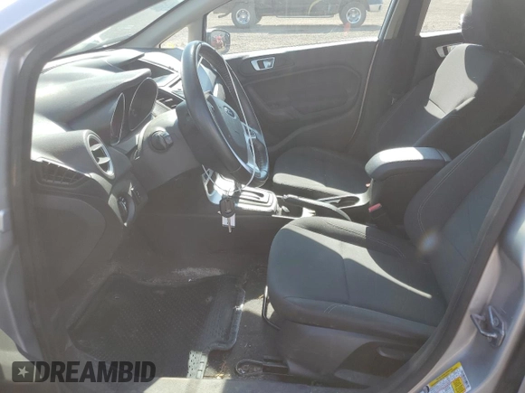 2015 Ford Fiesta SE z VIN 3FADP4EJ0FM212740, wystawiony jako Copart lot #63944573 z przebiegiem 123 037 mil mil oraz Szkoda całkowita • Salvage title. Historia ofert i sprzedaży dostępna na DreamBid. Obrazek 7.
