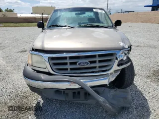 2001 Ford F-150 with VIN 1FTPX17L21NA37619, listed as a Copart auction lot 56922485 with 212,148 mi miles and Salvage title. Bid and sale history available at DreamBid. Image 5.