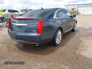 2013 Cadillac XTS Platinum z VIN 2G61V5S32D9102537, wystawiony jako IAAI lot #42230895 z przebiegiem 120 810 mil mil oraz . Historia ofert i sprzedaży dostępna na DreamBid. Obrazek 4.