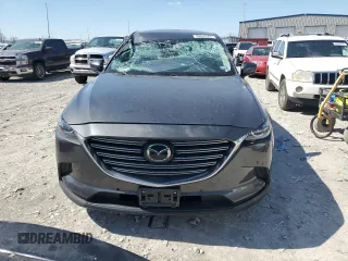 2021 Mazda CX-9 Touring z VIN JM3TCACY5M0500924, wystawiony jako Copart lot #50654505 z przebiegiem 57 067 mil mil oraz Szkoda całkowita • Salvage title. Historia ofert i sprzedaży dostępna na DreamBid. Obrazek 5.