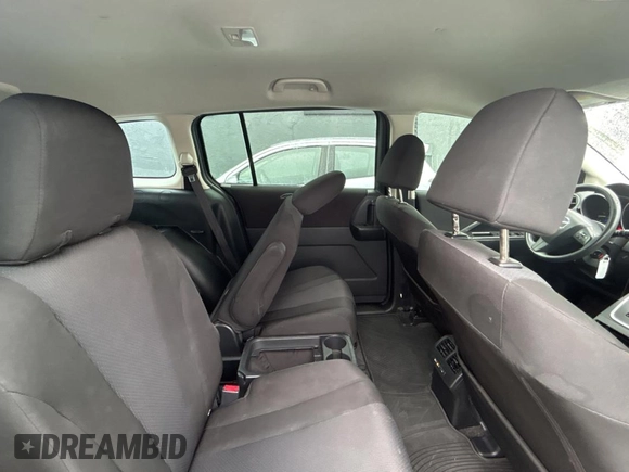 2015 Mazda 5 Sport z VIN JM1CW2BLXF0182880, wystawiony jako Copart lot #56959895 z przebiegiem 117 395 mil mil oraz Czysty tytuł • Clean title. Historia ofert i sprzedaży dostępna na DreamBid. Obrazek 6.