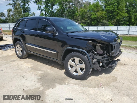 2013 Jeep Grand Cherokee Laredo with VIN 1C4RJEAG2DC519570, listed as a Copart auction lot 52066225 with 129,091 mi miles and Salvage Title. Bid and sale history available at carsss.com. Image 4.