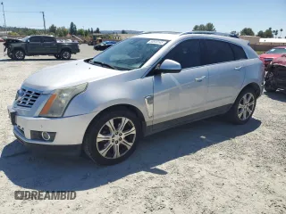2015 Cadillac SRX Performance Collection with VIN 3GYFNFE31FS595552, listed as a Copart auction lot 55849145 with 149,601 mi miles and Salvage title. Bid and sale history available at DreamBid. Image 1.
