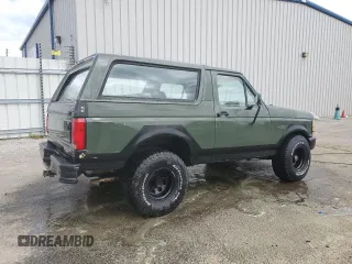 1992 Ford Bronco XL with VIN 1FMEU15N2NLA71562, listed as a Copart auction lot 48827285 with 198,042 mi miles and Salvage Title. Bid and sale history available at carsss.com. Image 3.