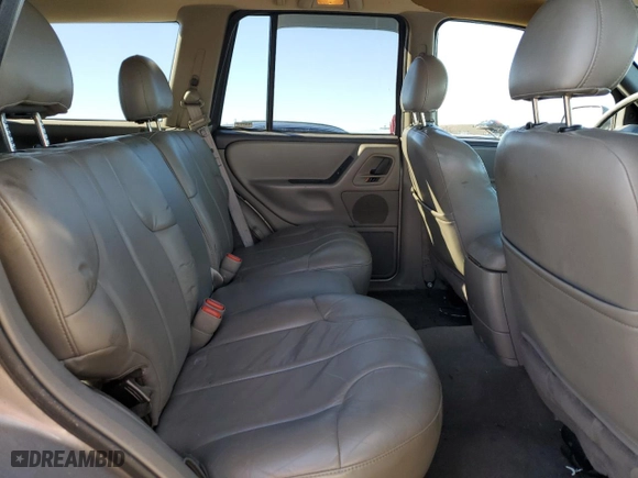 1999 Jeep Grand Cherokee Laredo with VIN 1J4GW58NXXC776438, listed as a Copart auction lot 84412044 with 163,060 mi miles and Salvage Title. Bid and sale history available at carsss.com. Image 11.