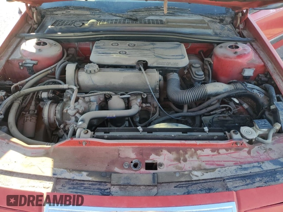 1989 Chrysler LeBaron z VIN 1C3XJ45K0KG251502, wystawiony jako Copart lot #87112404 z przebiegiem 166 445 mil mil oraz Tytuł czysty. Historia ofert i sprzedaży dostępna na DreamBid. Obrazek 11.