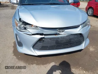 2014 Scion tC with VIN JTKJF5C70E3068144, listed as a IAAI auction lot 41983751 with 137,894 mi miles. Bid and sale history available at carsss.com. Image 6.
