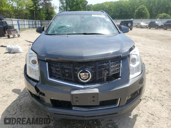 2015 Cadillac SRX z VIN 3GYFNAE31FS571500, wystawiony jako Copart lot #54106885 z przebiegiem 123 114 mil mil oraz Szkoda całkowita • Salvage title. Historia ofert i sprzedaży dostępna na DreamBid. Obrazek 5.