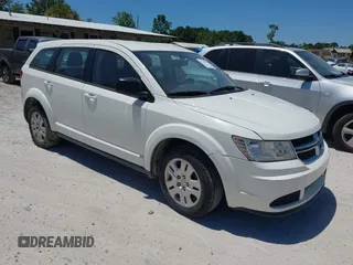 2015 Dodge Journey American Value z VIN 3C4PDCAB5FT537950, wystawiony jako IAAI lot #42312225 z przebiegiem 198 881 mil mil oraz . Historia ofert i sprzedaży dostępna na DreamBid. Obrazek 1.