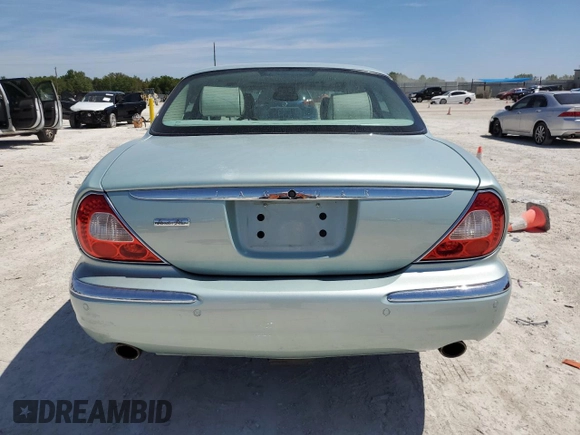 2005 Jaguar XJ Vanden Plas z VIN SAJWA82CX5SG35644, wystawiony jako Copart lot #49029245 z przebiegiem 88 771 mil mil oraz Szkoda całkowita • Salvage title. Historia ofert i sprzedaży dostępna na DreamBid. Obrazek 6.