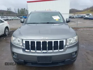 2012 Jeep Grand Cherokee Laredo with VIN 1C4RJFAGXCC118823, listed as a IAAI auction lot 41808398 with 153,509 mi miles. Bid and sale history available at carsss.com. Image 12.