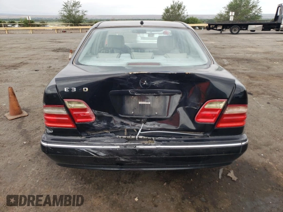 2000 Mercedes-Benz E-Class with VIN WDBJF65J5YB068297, listed as a Copart auction lot 69199004 with 236,751 mi miles and Salvage Title. Bid and sale history available at carsss.com. Image 6.