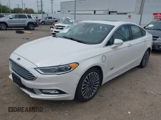 2017 Ford Fusion Titanium with VIN 3FA6P0SUXHR147336, listed as a IAAI auction lot 41873106 with 103,247 mi miles and . Bid and sale history available at DreamBid. Image 2.