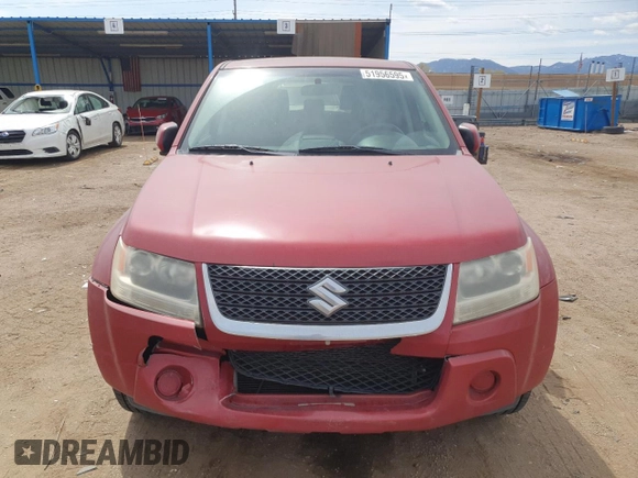2012 Suzuki Grand Vitara Premium z VIN JS3TD0D20C4101342, wystawiony jako Copart lot #51956595 z przebiegiem 166 710 mil mil oraz Szkody całkowita. Historia ofert i sprzedaży dostępna na DreamBid. Obrazek 5.