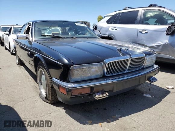 1990 Jaguar XJ with VIN SAJKY1745LC622713, listed as a Copart auction lot 56545414 with Not Provided miles and Salvage Title. Bid and sale history available at DreamBid. Image 4.