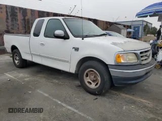2000 Ford F-150 XL with VIN 1FTRX17L5YKA74815, listed as a Copart auction lot 85821444 with 0 mi miles and Salvage Title. Bid and sale history available at carsss.com. Image 4.
