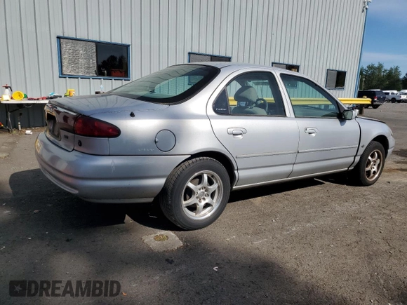 1998 Ford Contour LX with VIN 1FAFP66L2WK290948, listed as a Copart auction lot 56204295 with 76,307 mi miles and Salvage title. Bid and sale history available at DreamBid. Image 3.