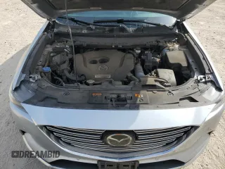 2020 Mazda CX-9 Grand Touring z VIN JM3TCADY0L0417673, wystawiony jako Copart lot #44625195 z przebiegiem 94 221 mil mil oraz Szkoda całkowita • Salvage title. Historia ofert i sprzedaży dostępna na DreamBid. Obrazek 12.