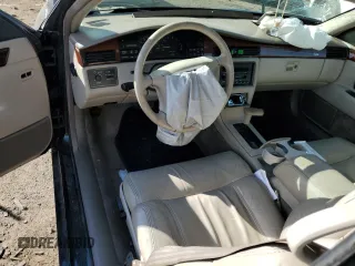 1995 Cadillac Eldorado z VIN 1G6EL12Y1SU623065, wystawiony jako Copart lot #78058414 z przebiegiem 115 060 mil mil oraz Czysty tytuł • Clean title. Historia ofert i sprzedaży dostępna na DreamBid. Obrazek 8.