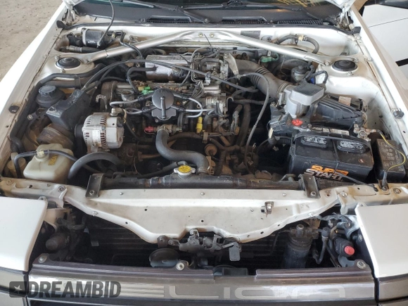 1986 Toyota Celica z VIN JT2ST64CXG7013064, wystawiony jako Copart lot #44228575 z przebiegiem 101 881 mil mil oraz Szkoda całkowita • Salvage title. Historia ofert i sprzedaży dostępna na DreamBid. Obrazek 11.