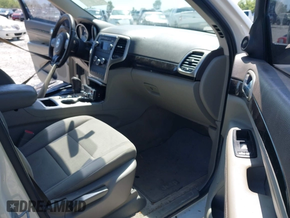 2011 Jeep Grand Cherokee Laredo with VIN 1J4RS4GG5BC573337, listed as a IAAI auction lot 41960369 with 185,518 mi miles and . Bid and sale history available at DreamBid. Image 5.