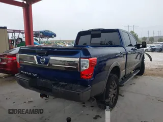 2016 Nissan Titan Platinum Reserve z VIN 1N6BA1F20GN509360, wystawiony jako IAAI lot #41921670 z przebiegiem 164 784 mil mil oraz . Historia ofert i sprzedaży dostępna na DreamBid. Obrazek 4.