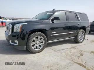 2015 GMC Yukon Denali with VIN 1GKS2CKJ2FR580533, listed as a Copart auction lot 48455205 with 147,532 mi miles and Salvage Title. Bid and sale history available at carsss.com. Image 1.