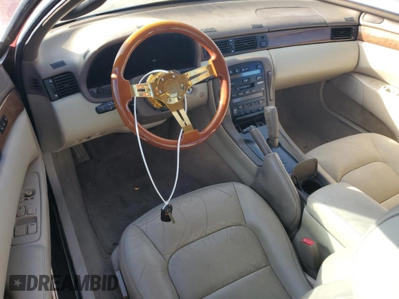 1997 Lexus SC 300 z VIN JT8CD32Z1V0040141, wystawiony jako Copart lot #85372924 z przebiegiem Nie podano mil oraz Szkody całkowita. Historia ofert i sprzedaży dostępna na DreamBid. Obrazek 8.