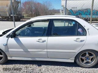 2002 Mitsubishi Lancer OZ-Rally with VIN JA3AJ86E42U039140, listed as a IAAI auction lot 41853888 with 328,181 mi miles. Bid and sale history available at carsss.com. Image 14.
