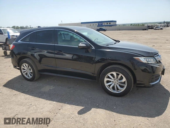 2016 Acura RDX Technology with VIN 5J8TB4H56GL012825, listed as a Copart auction lot 61005445 with 129,242 mi miles and Salvage title. Bid and sale history available at DreamBid. Image 4.