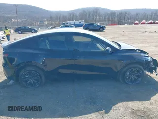 2025 Tesla Model Y Long Range with VIN 7SAYGDEEXSF267888, listed as a IAAI auction lot 41807129 with 3,002 mi miles and . Bid and sale history available at DreamBid. Image 13.