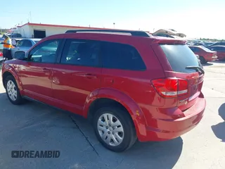 2015 Dodge Journey SE z VIN 3C4PDCAB5FT679585, wystawiony jako IAAI lot #42090600 z przebiegiem 166 876 mil mil oraz . Historia ofert i sprzedaży dostępna na DreamBid. Obrazek 3.