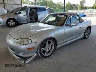 2004 Mazda MX-5 Miata LS with VIN JM1NB353X40404238, listed as a Copart auction lot 61601895 with 110,549 mi miles and Salvage title. Bid and sale history available at DreamBid. Image 1.