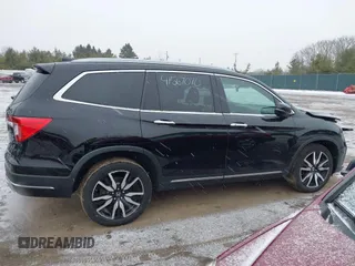 2021 Honda Pilot Touring 8-Passenger z VIN 5FNYF6H94MB091384, wystawiony jako IAAI lot #41567070 z przebiegiem 78 330 mil mil oraz . Historia ofert i sprzedaży dostępna na DreamBid. Obrazek 13.