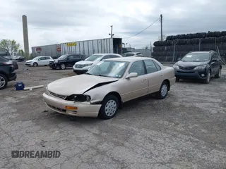 1996 Toyota Camry DX with VIN 4T1BG12K7TU813773, listed as a IAAI auction lot 42084977 with 49,453 mi miles. Bid and sale history available at carsss.com. Image 2.
