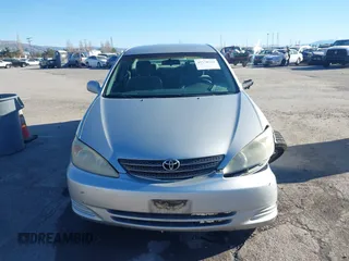 2002 Toyota Camry XLE z VIN 4T1BF30K82U506516, wystawiony jako IAAI lot #41278261 z przebiegiem 211 049 mil mil oraz . Historia ofert i sprzedaży dostępna na DreamBid. Obrazek 12.