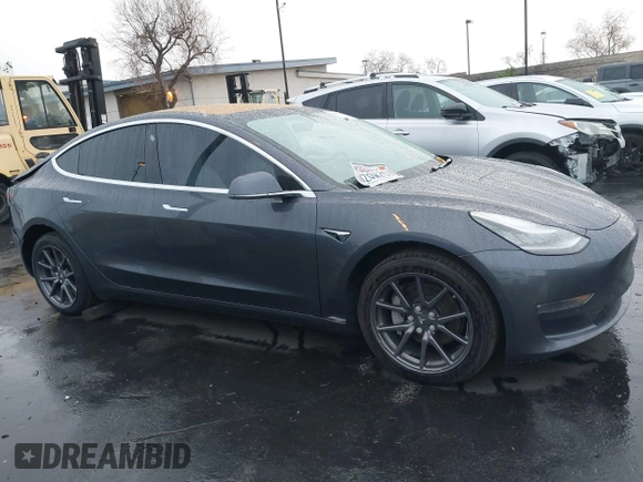 2018 Tesla Model 3 Long Range Battery with VIN 5YJ3E1EB1JF149423, listed as a IAAI auction lot 41896090 with 158,787 mi miles and . Bid and sale history available at DreamBid. Image 14.