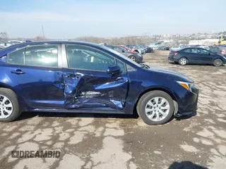 2023 Toyota Corolla Hybrid LE with VIN JTDBCMFE7PJ005985, listed as a IAAI auction lot 41574856 with 31,568 mi miles. Bid and sale history available at carsss.com. Image 6.