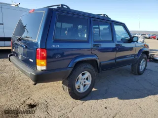 2001 Jeep Cherokee Sport with VIN 1J4FF48S61L617340, listed as a Copart auction lot 52340995 with 210,256 mi miles and Clean Title. Bid and sale history available at carsss.com. Image 3.