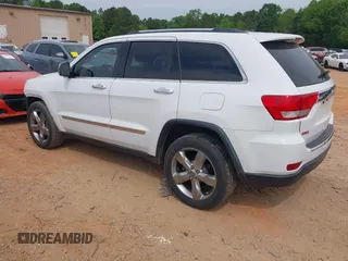 2013 Jeep Grand Cherokee Overland with VIN 1C4RJECGXDC621227, listed as a IAAI auction lot 42098042 with 194,232 mi miles and . Bid and sale history available at DreamBid. Image 3.
