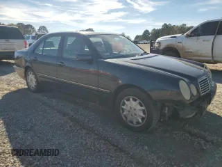 1998 Mercedes-Benz E 320 with VIN WDBJF25F3WA578364, listed as a Copart auction lot 77551834 with 228,913 mi miles and Salvage Title. Bid and sale history available at DreamBid. Image 4.